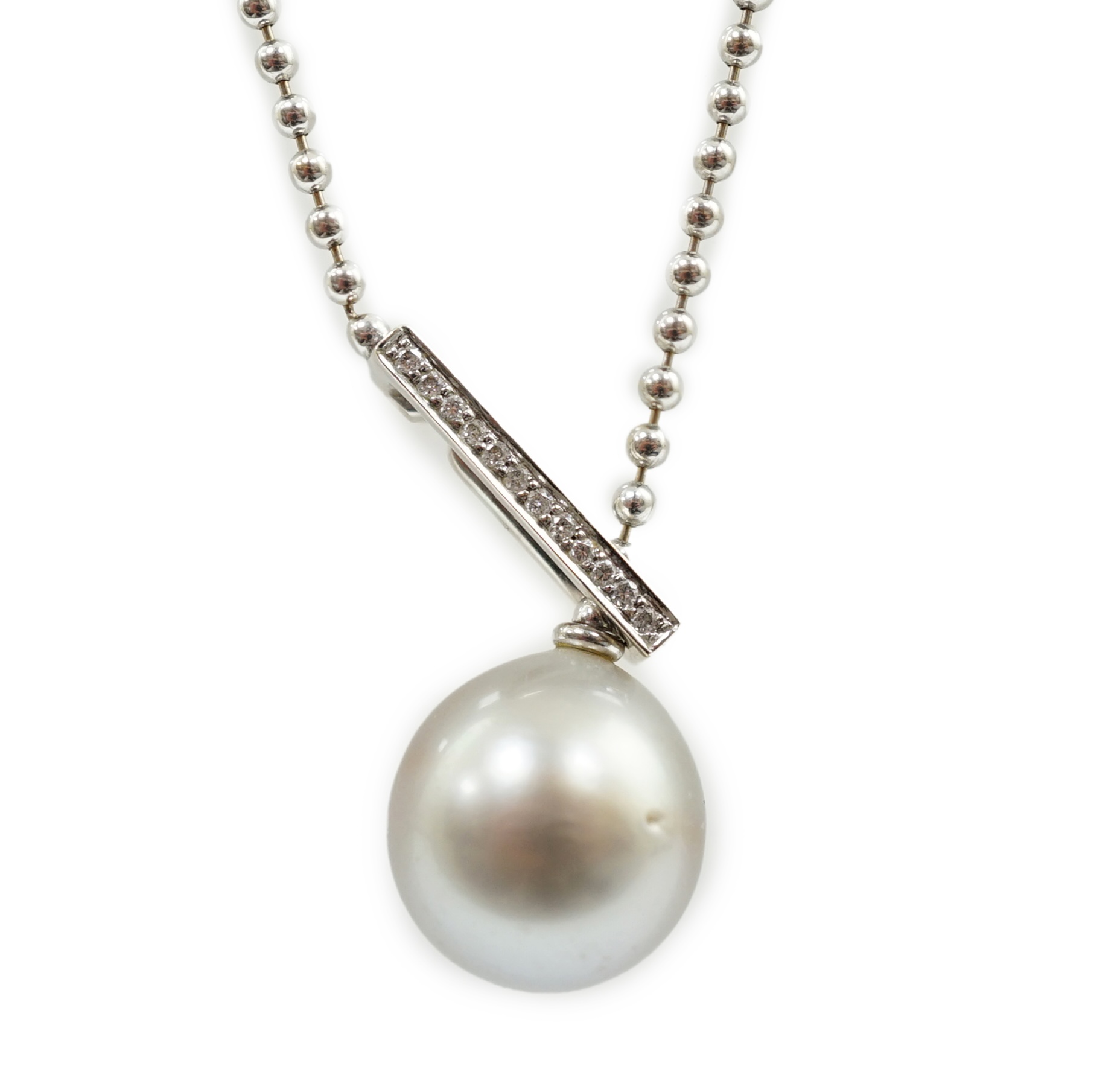 A modern Boodles & Dunthorne 18ct white gold, single stone Tahitian cultured pearl and diamond chip set pendant necklace